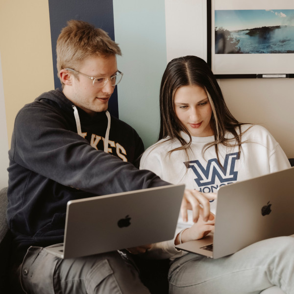 Student researching with faculty